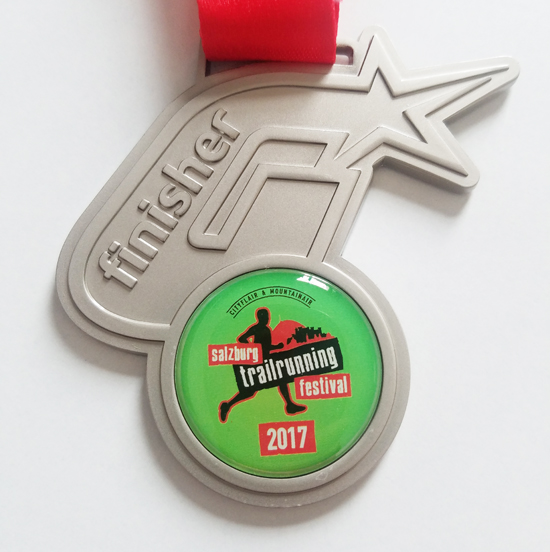 Diecast medal with sticker