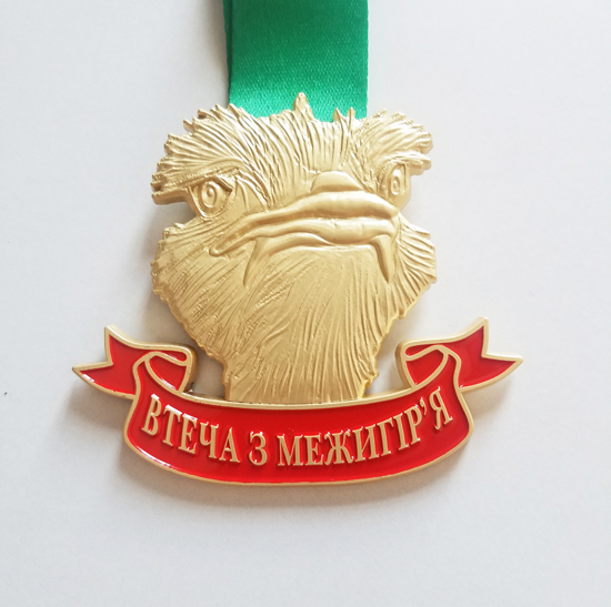 goshawk head medal with red coloring